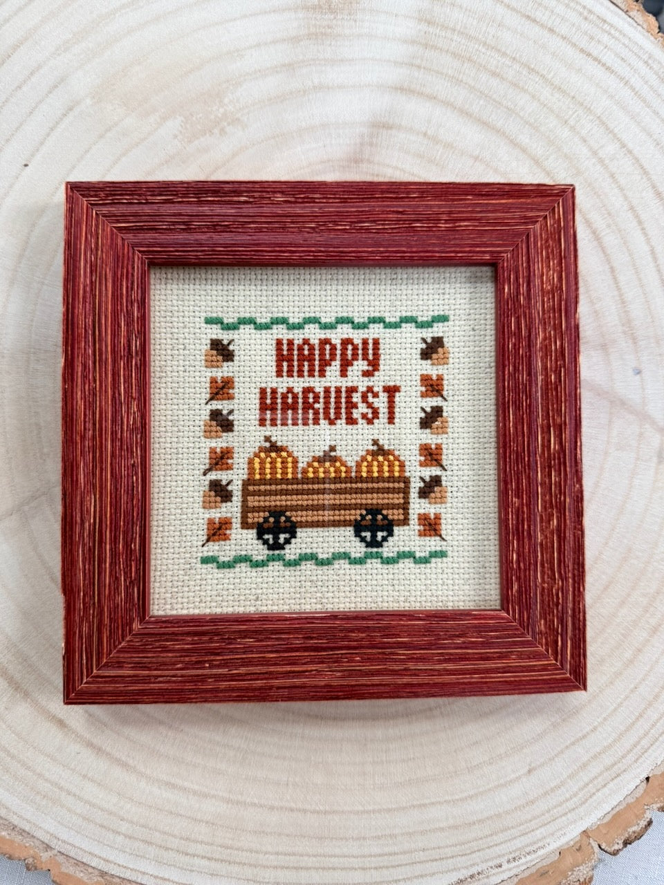 Fall Happy Harvest cross stitch framed, flat top-down view showing full design