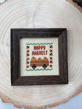 Hand-Stitched Fall Happy Harvest cross stitch in Dark Walnut frame, detail view