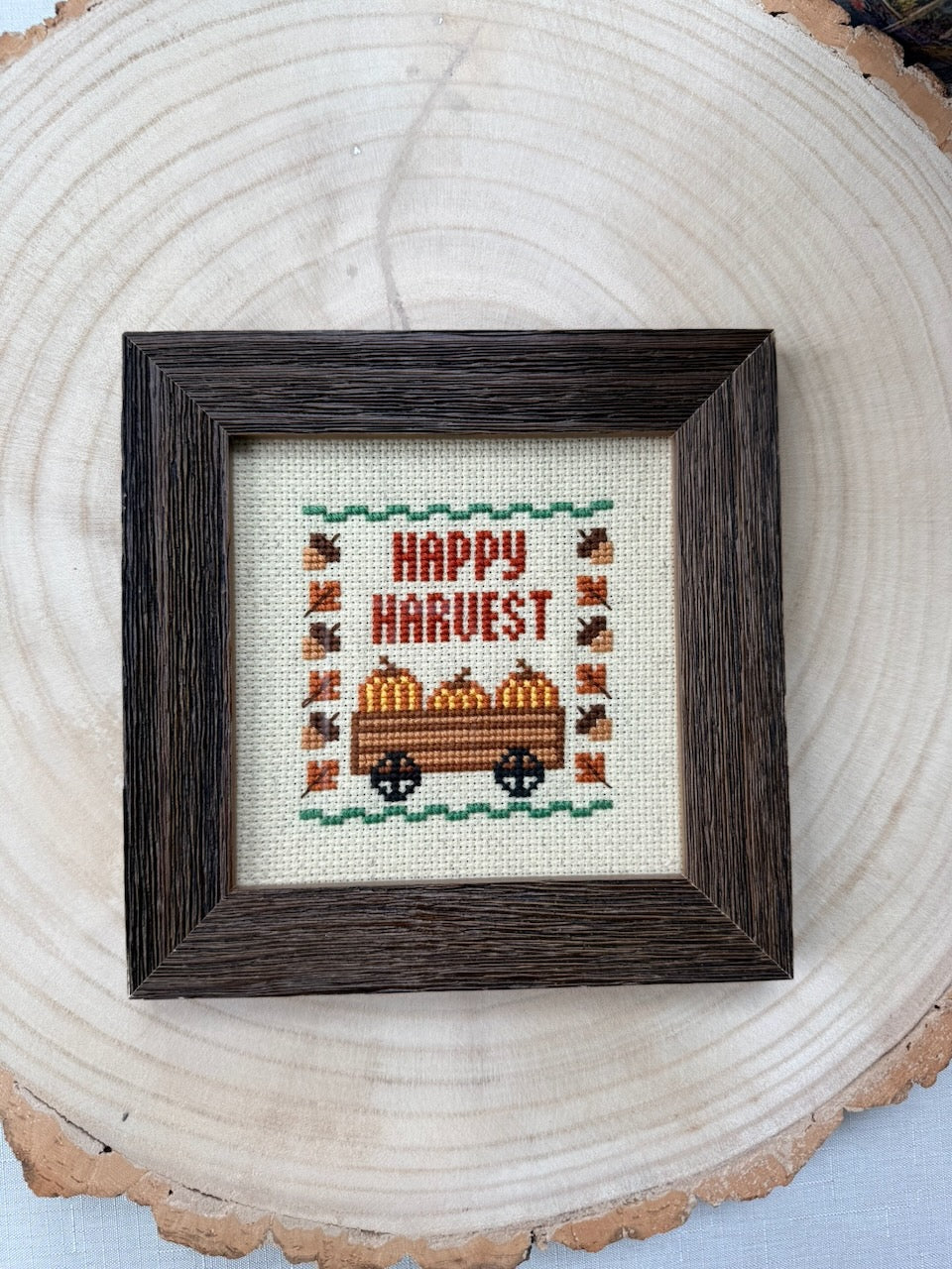 Hand-Stitched Fall Happy Harvest cross stitch in Dark Walnut frame, detail view