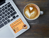 Stardew Valley Triple Shot Espresso die-cut sticker on a laptop next to a latte with heart latte art