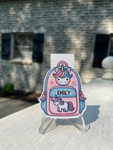Personalized unicorn in a backpack magnetic bookmark with a custom name on the backpack pocket