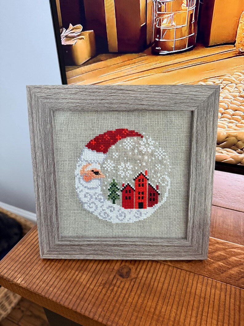 Framed cross-stitch, Santa Christmas Village, gray frame