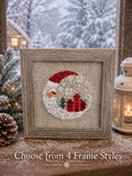 Framed cross-stitch, Santa Christmas Village, shows 4 frame style options