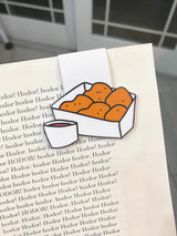Chicken Nuggets Magnetic Bookmark clipped over a book page corner, detail view of nuggets and sauce cup