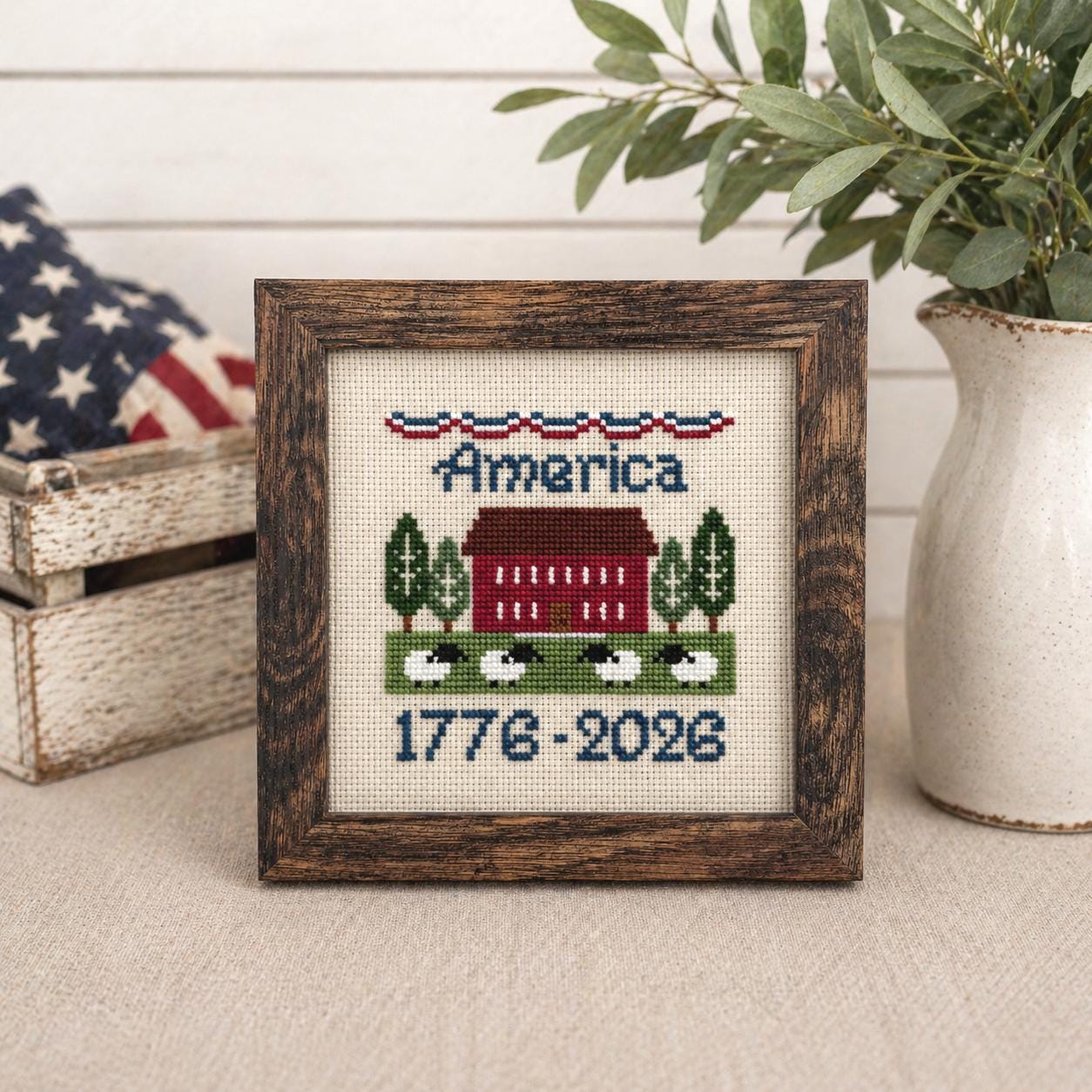 Hand-stitched America cross-stitch, framed, red barn with sheep