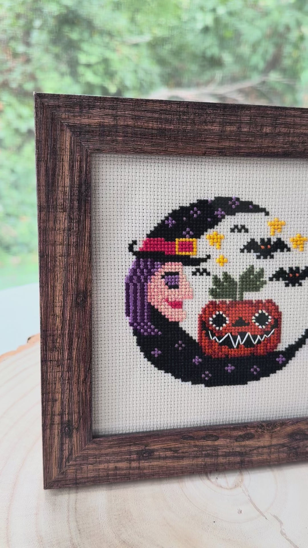 Video of the framed Halloween Witch Moon cross stitch, brown frame