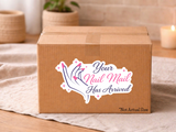 Your Nail Mail Has Arrived packaging sticker with a pink-nailed hand and sparkles on a kraft shipping box